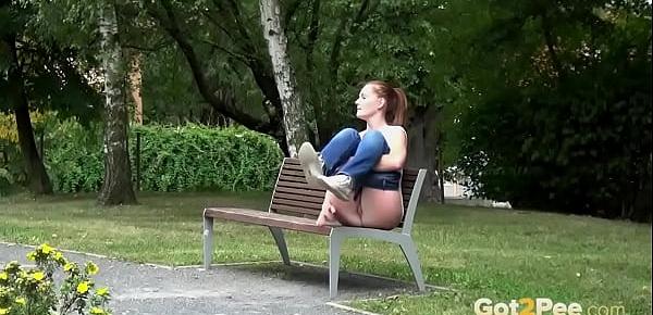  Cheeky Redhead Pisses While Sitting On Bench